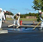 Sealcoating or pavement sealing